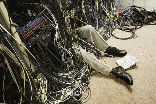 buried by cables on a messy data center